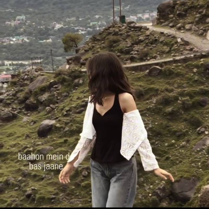 Demo screenshot of a girl on a hilltop showing the VN slow motion lyrics reel effect