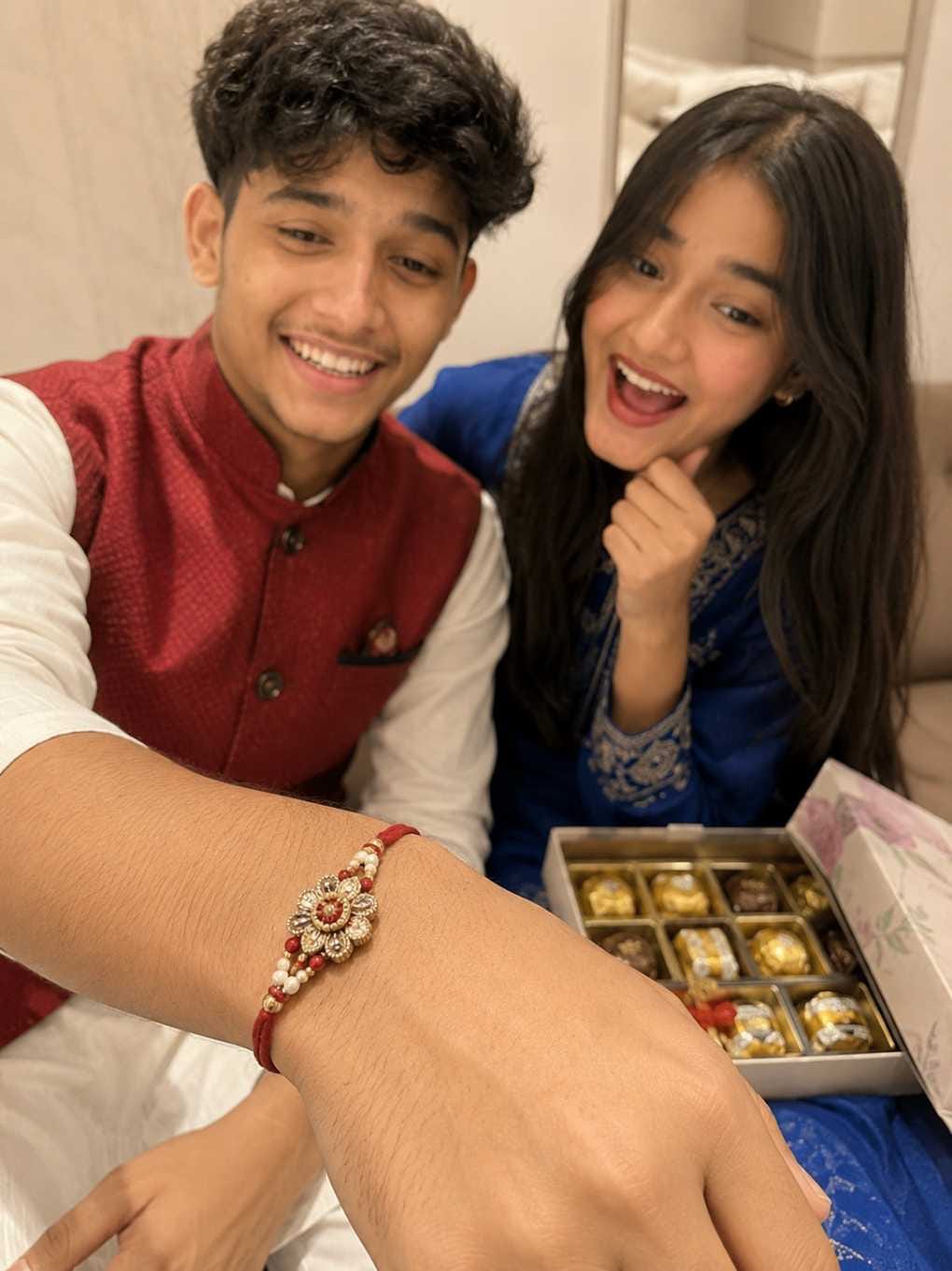 Raksha Bandhan AI photo prompt rakhi wrist selfie chocolate box style - RonyTica