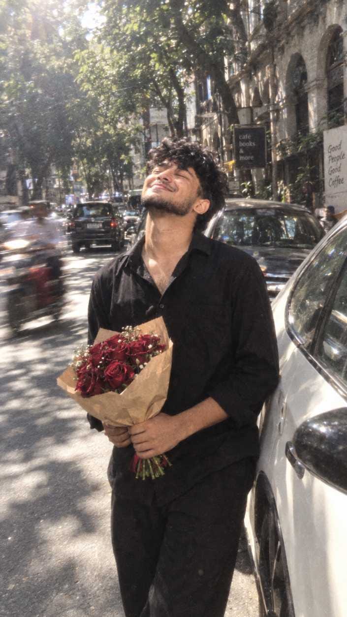Boy holding rose bouquet on city street turned into AI lockscreen wallpaper prompt style illustration