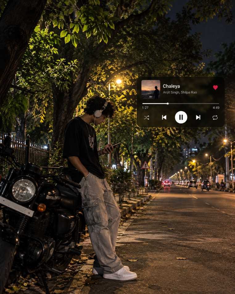 AI photo of a boy with headphones leaning on a black Royal Enfield bike on a night street with a music player overlay showing the song Chaleya